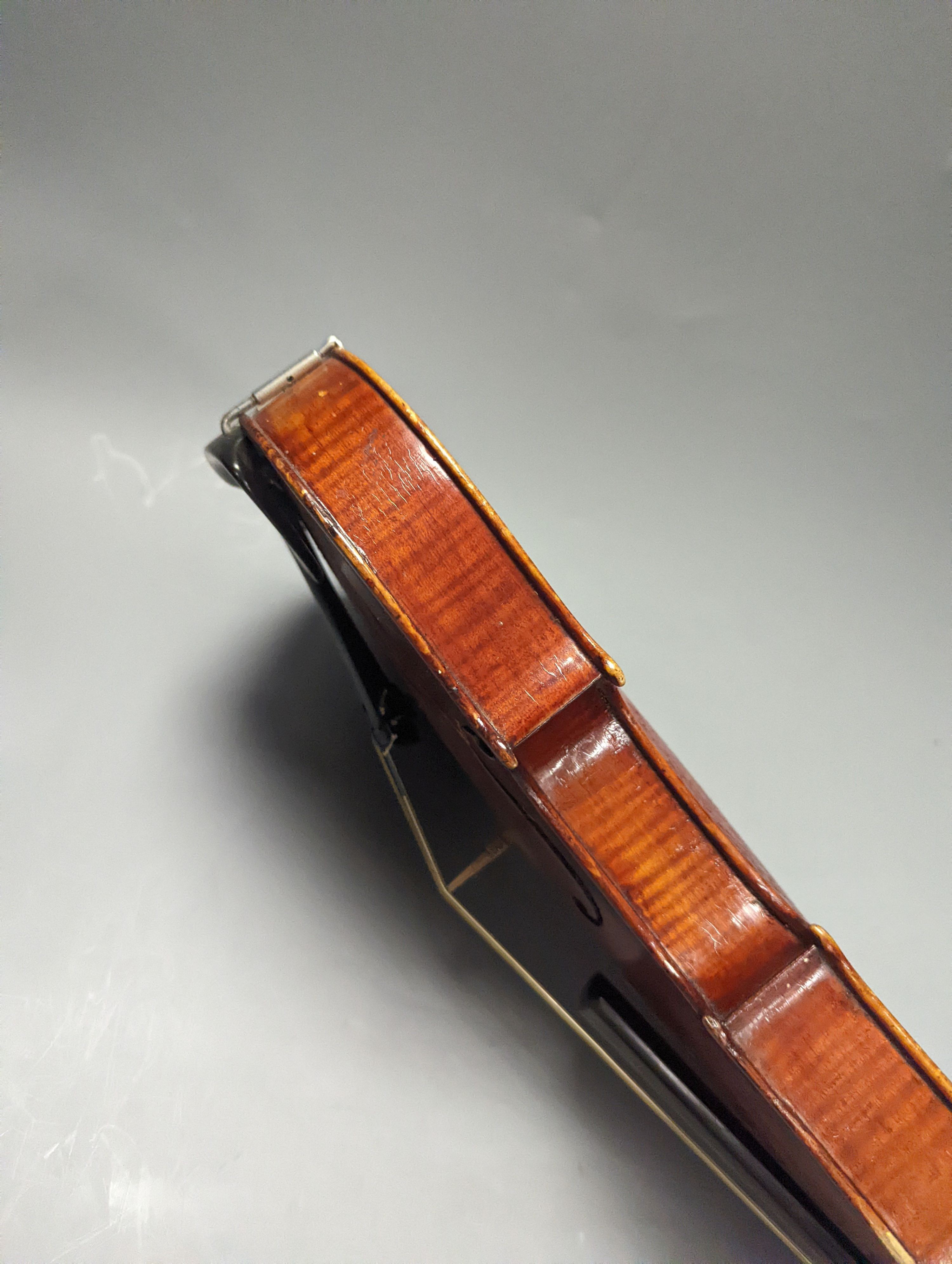 A violin in a mahogany case, case makers, Withers and sons, case 79 cms high.